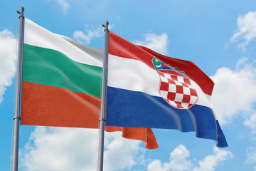 Croatia and Bulgaria flags waving in the wind against white cloudy blue sky together. Diplomacy...