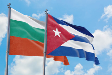 Cuba and Bulgaria flags waving in the wind against white cloudy blue sky together. Diplomacy concept, international relations.