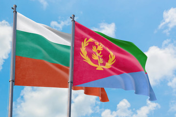 Fototapeta na wymiar Eritrea and Bulgaria flags waving in the wind against white cloudy blue sky together. Diplomacy concept, international relations.