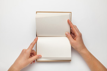 A5 open book mockup with hands. Empty template of page. Blank for design. Isolated on white background.
