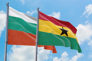 Ghana and Bulgaria flags waving in the wind against white cloudy blue sky together. Diplomacy concept, international relations.