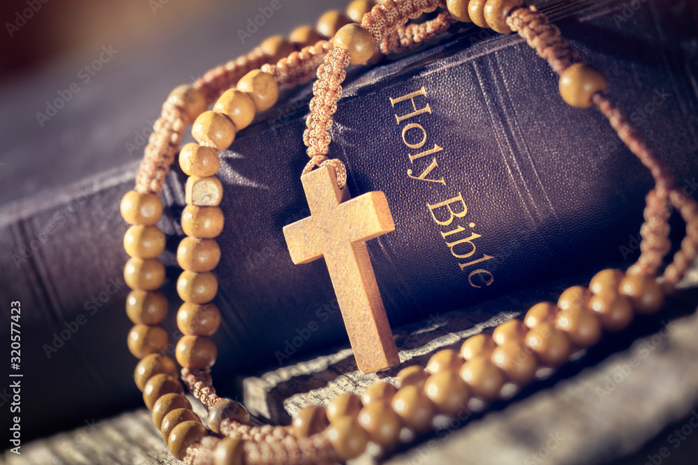 Wall mural rosary beads and crucifix cross on holy bible