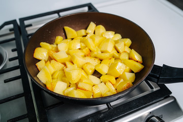 Cooking fried potatoes. Frying potatoes on the frying pan