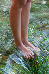 Girl's legs on the Mreznica River, Croatia