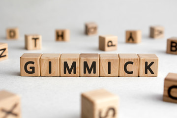 Gimmick - words from wooden blocks with letters, gimmick concept, white background