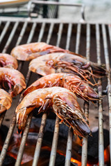 Grilled shrimps on the flaming grill.