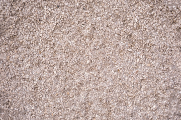 The texture of the wall is made of concrete and stone chips. Architecture.