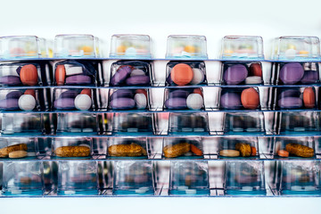 Pills in blisters for every day of the week for the morning, day, night time. Medications for patients in a hospital.