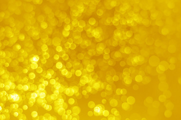 abstract yellow bokeh glitter sparkle background.