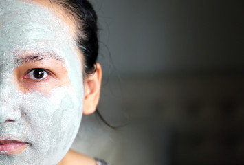 Close up beautiful Asia women Face Mask pad and skin care.