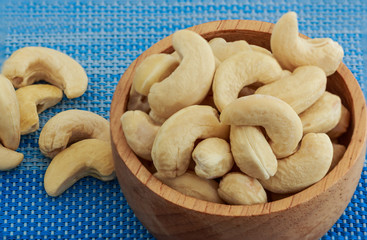 Cashew nuts with fabric background on table