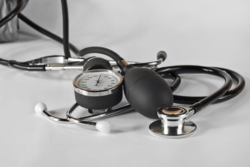 Medical pressure measuring equipment. Black gauge on a white background.