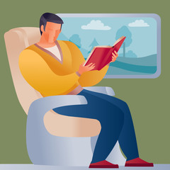 man traveling by train or going to a business meeting, the landscape is visible in the window and he is reading a red book,