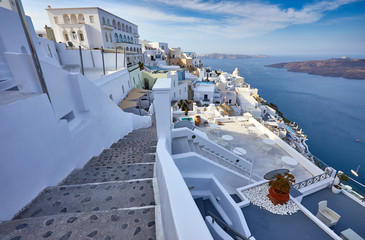 Fira town on Santorini island, Greece. Incredibly romantic sunrise on Santorini. Oia village in the morning light. Amazing sunset view with white houses. Island lovers