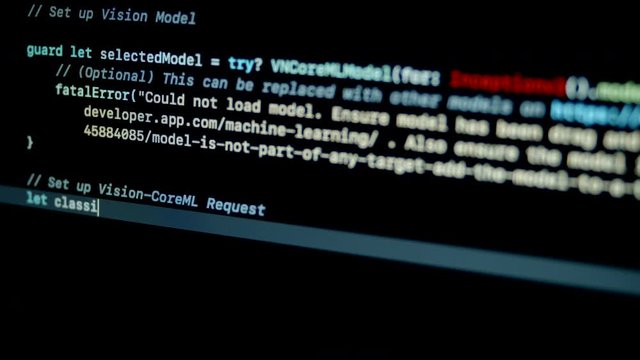 4.2 Developer type artificial Intelligence application with core machine learning on swift programming language on laptop screen
