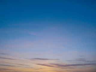 Clear sky with small clouds on the horizon at sunset. Beautiful gentle sky at sunset background.