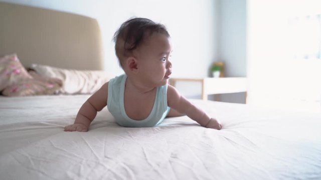 toddler roll over by herself. baby on tummy development flip from back to front