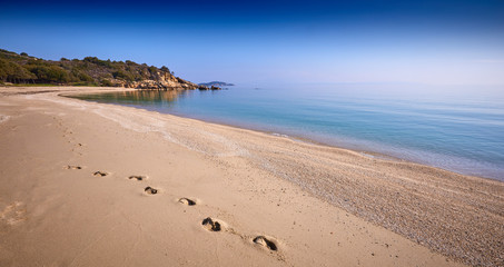 Amazing sunset view on Proti ammoudia beach near Olympiada town summer resort, Kavala region, Greece.. Incredibly romantic sunrise on the beach, Ionian Sea. View of the ocean. Tropical beach