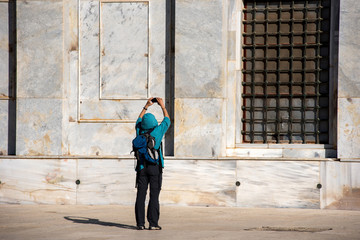 Tourist photographing the Dome of the Rock Islamic Shrine, Jerusalem