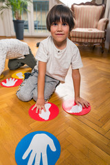 Group of Children Playing Twister Indoors