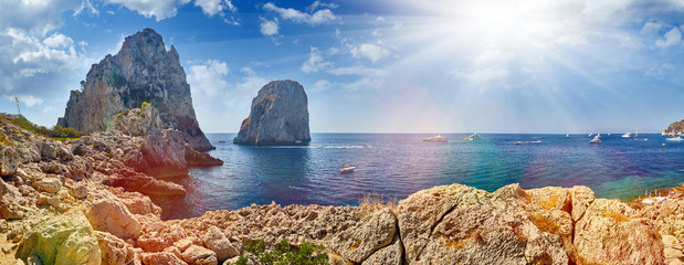 Stunning Capri island. Faraglioni cliffs panorama,and the stunning Tyrrhenian sea,Capri island,Campania,Italy,Europe. Mediterranean Sea summer coastal landscape.