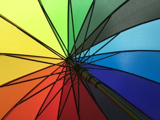 Rainbow umbrella carried with pride
