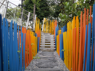 Yellow pipe decorate as a fence blurred blackground