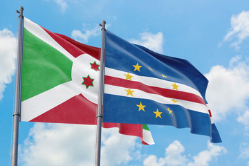 Cape Verde and Burundi flags waving in the wind against white cloudy blue sky together. Diplomacy concept, international relations.