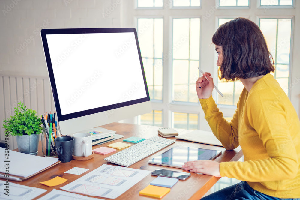 Aufkleber designer woman drawing a website outline and website ux app development on mobile phone.