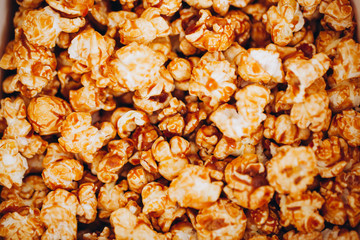 top view sweet caramelized candied popcorn in a white box