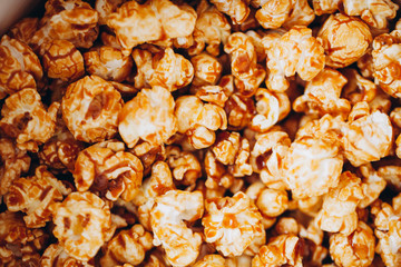 top view sweet caramelized candied popcorn in a white box