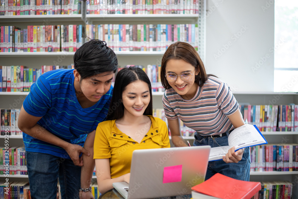 Poster group asian students smile and reading book and using notebook for helps to share ideas in the work 