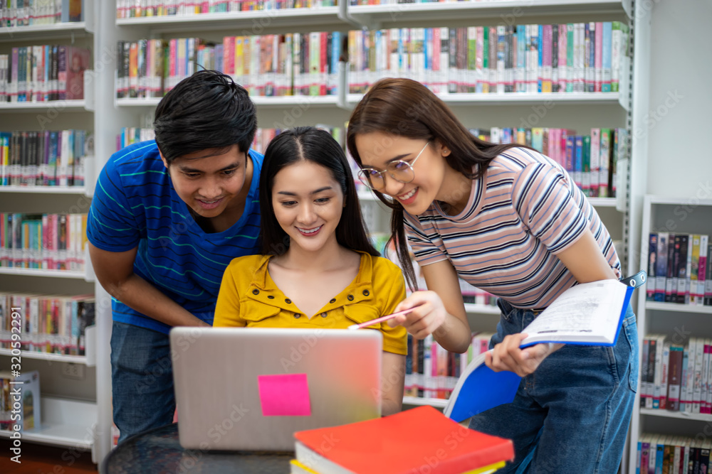 Poster group asian students smile and reading book and using notebook for helps to share ideas in the work 