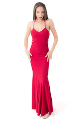 Naklejka premium Beautiful woman in red dress studio shot. 