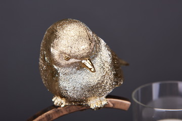 A Golden Bird Ornament commonly used by people in China and Asia. It can symbolize wealth and good luck