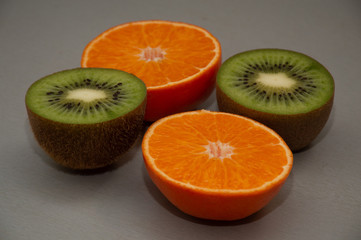 kiwi and orange on white background