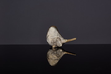 A Golden Bird Ornament commonly used by people in China and Asia. It can symbolize wealth and good luck