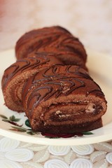 Delicious chocolate roll with cocoa cream macro