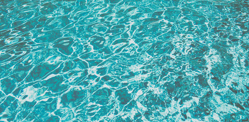 Ripple Water in swimming pool with sun reflection