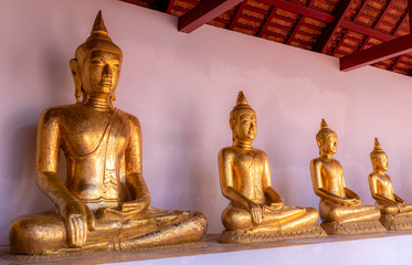 Close up line of Buddha images