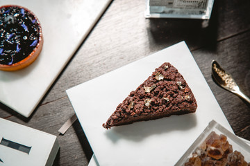 Chocolate cake and Blueberry pie on a marble plate.