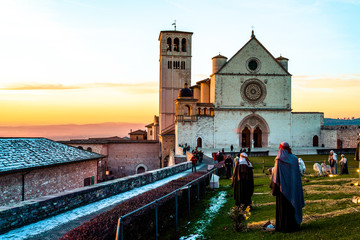 winter sunset at the Saint Francis church in assisi (italy) - obrazy, fototapety, plakaty