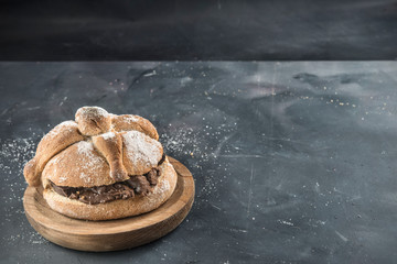 Pan de muerto with typical Mexican food