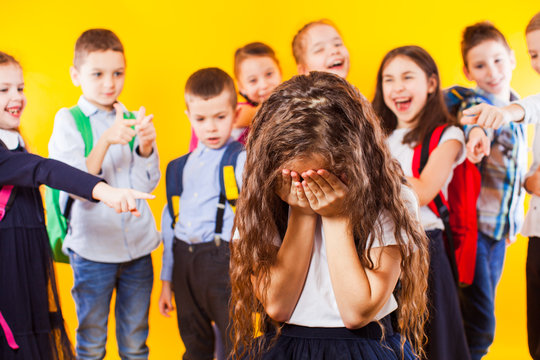 School girl being bullied by classmates. School bullying concept