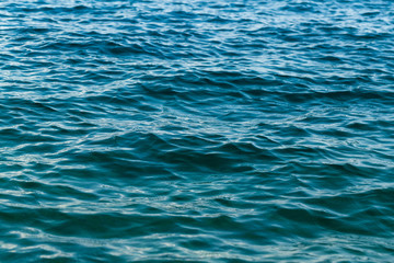 The surface of the sea water. Montenegro. Sea water aquamarine azure reflection turquoise blue