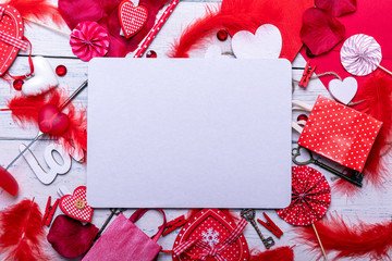 Wooden white background with red hearts and gifts. The concept of Valentine Day whith empty blank for text. Top view copy space.