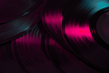 Vinyl records music background, texture, 80's, vintage, retro, acoustic, eighties, disco, gradient colours, close-up, party