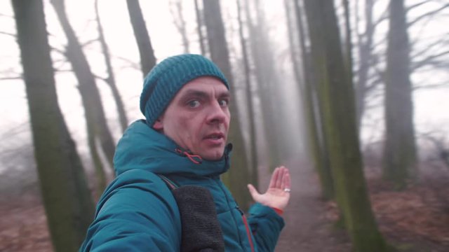 A video blogger traveler talks about dangerous animals in the autumn forests.