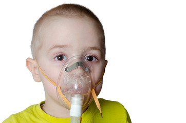 Little boy does inhalation. Treats pneumonia with a nebulizer
