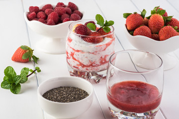 Chia pudding with strawberry sauce and berries.